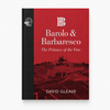 A hardcover book titled 'Barolo & Barbaresco: The Primacy of the Vine' by David Gleave, featuring a red cover with a vineyard illustration and a black spine, shown on a light gray background.