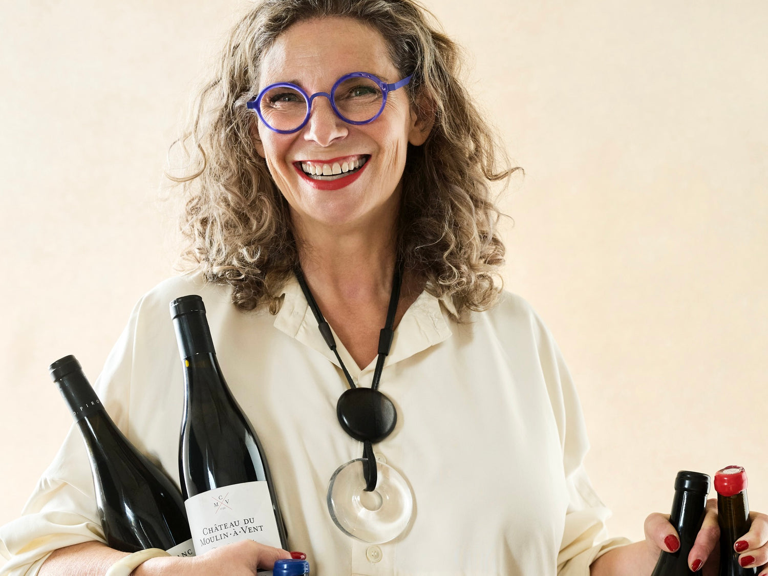 Natasha Hughes MW with Beaujolais bottles