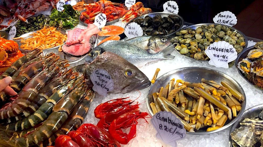 Portugese fish stand with various sea food, mosculles, and fish
